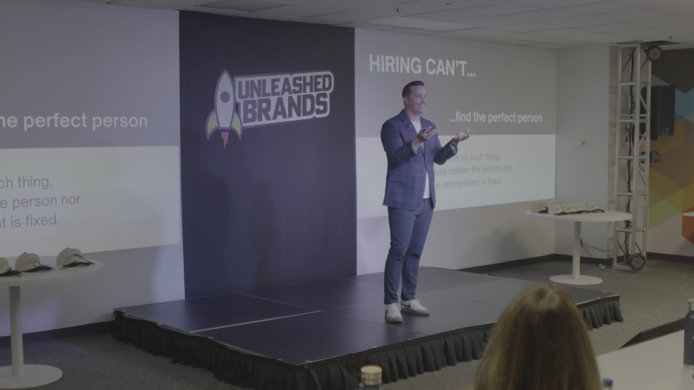 Breck Wightman speaking on stage at Unleashed Brands